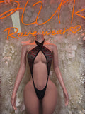 Black plunge bodysuit with halter straps, mesh panels, and cutout front
