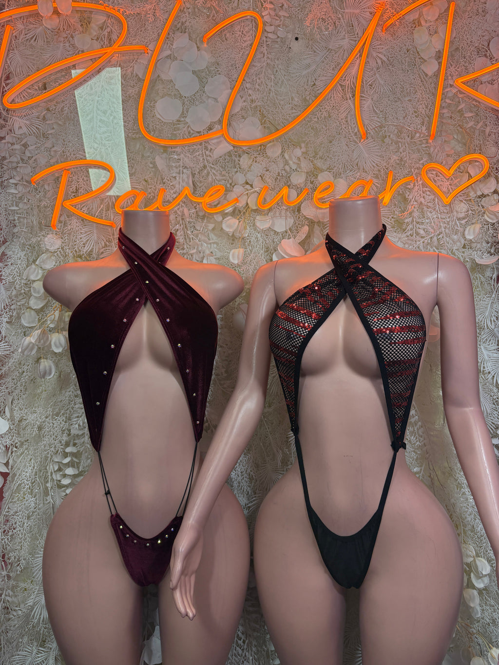 Black plunge bodysuit with strappy halter top and open back design