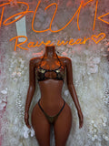 Bronze metallic strappy bodysuit with bralette-style top and thong bottom, front view