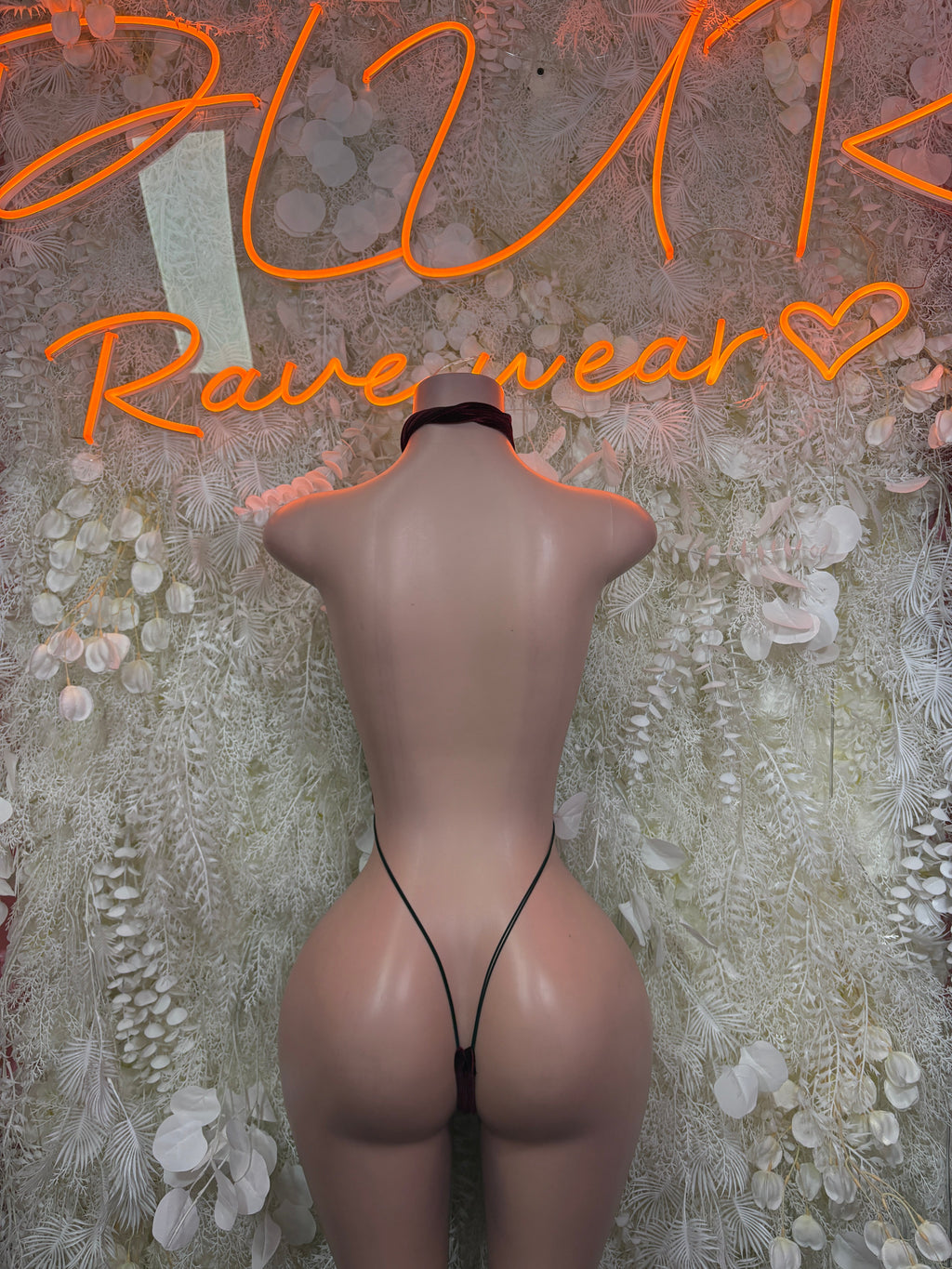 Burgundy velvet plunge bodysuit with thin back straps, open back and low cut.