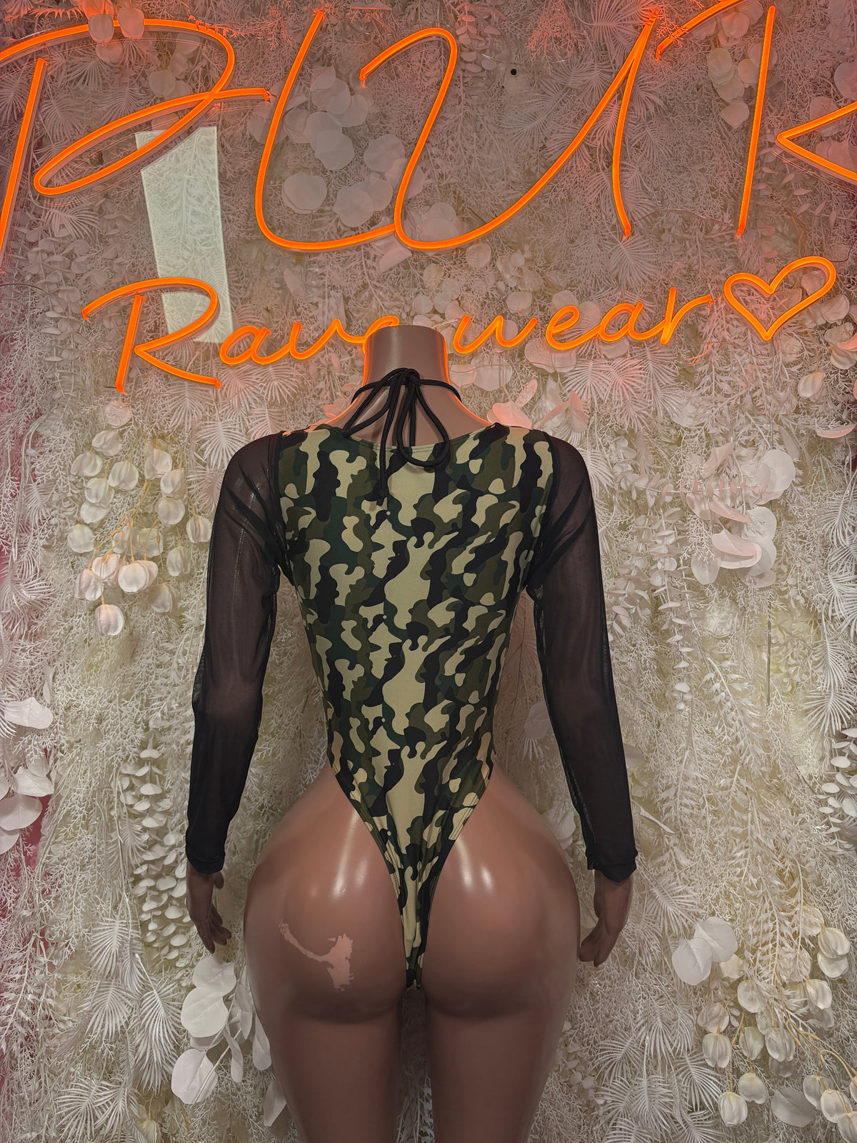 Camouflage lace-up bodysuit with sheer black long sleeves, back view