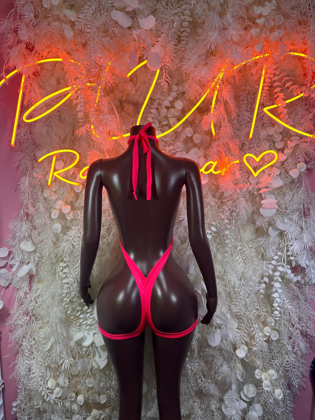 Cutout one-piece bodysuit with halter bow, red and black, deep back and chest cutouts