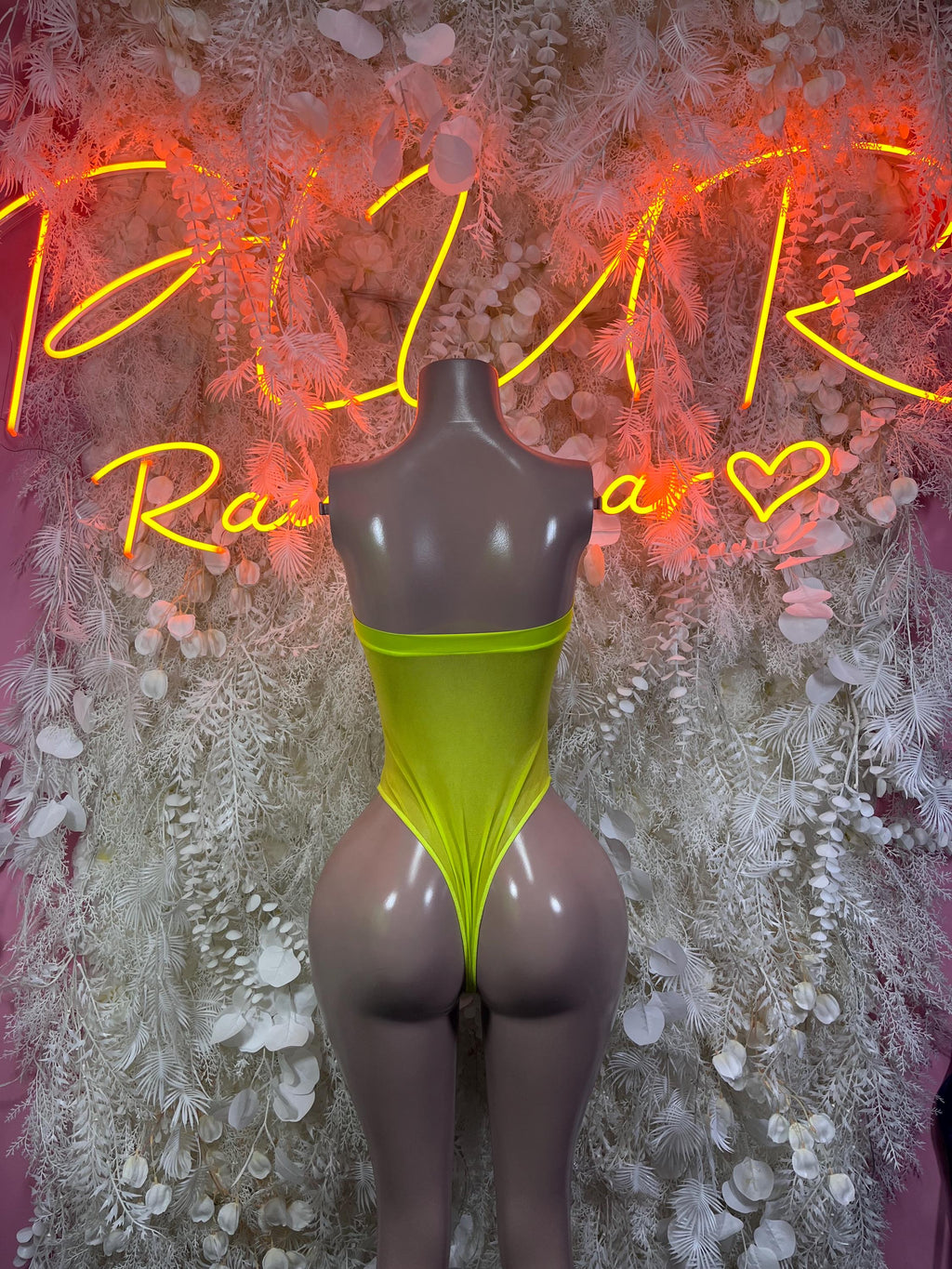 Neon green one-piece bodysuit with scoop back and high-cut leg