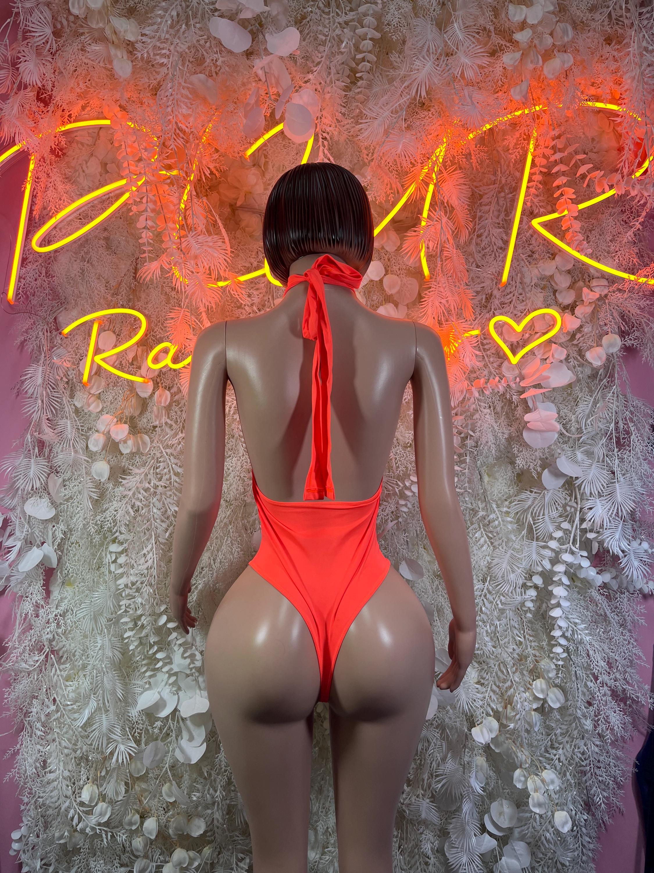 Neon orange one-piece bodysuit with open back and high neck