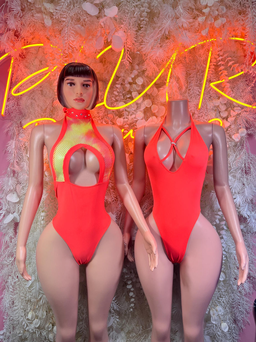 Neon orange one-piece bodysuit shown front and back on mannequins