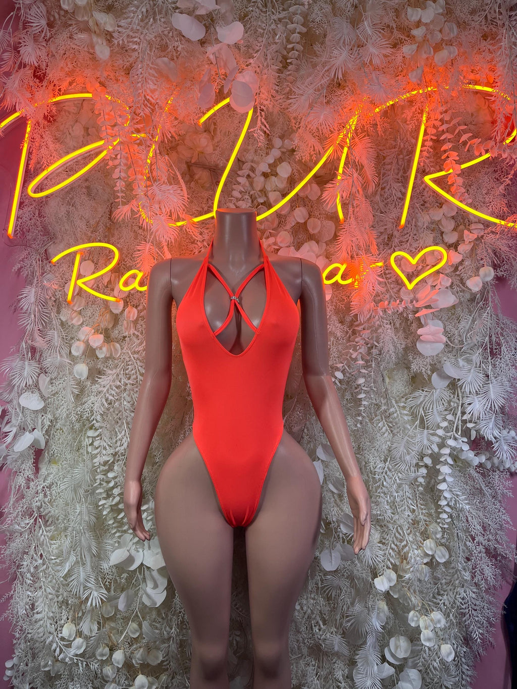 Neon orange one-piece bodysuit with front cutout and thin crossover straps