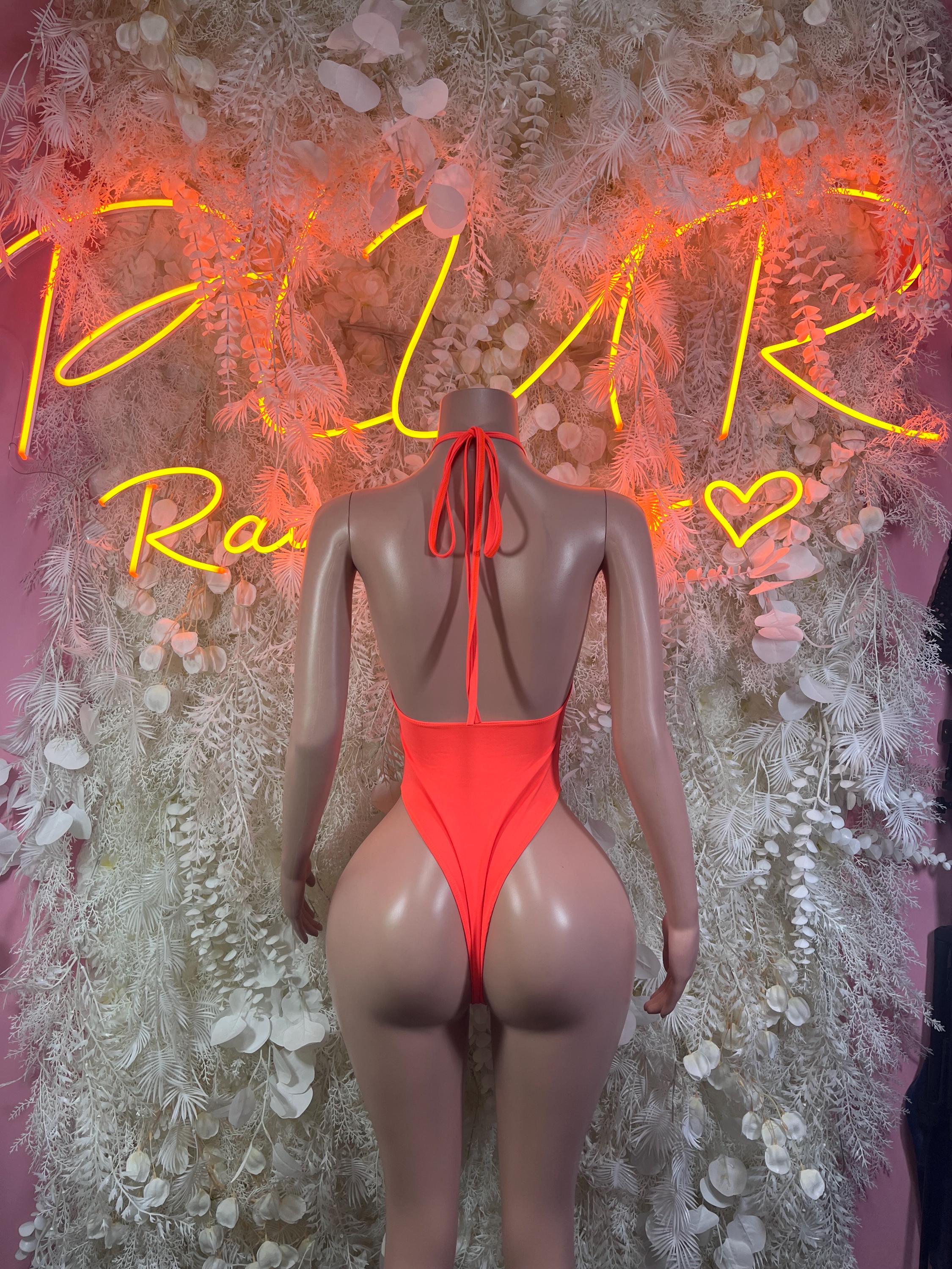 Neon orange backless one-piece bodysuit with crisscross back and neck tie