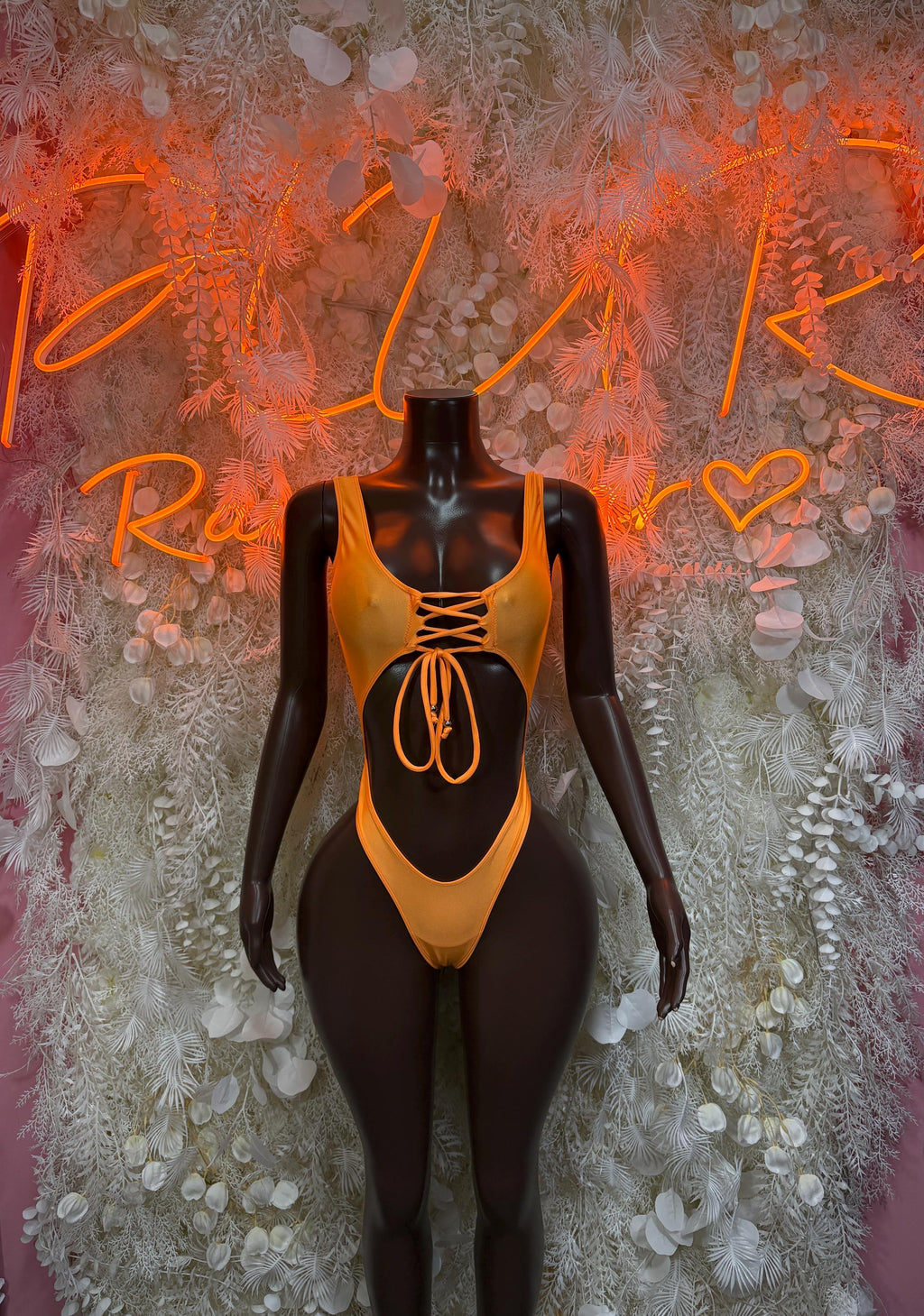 Orange lace-up cutout bodysuit with string tie front
