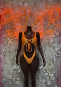 Orange lace-up cutout bodysuit with string tie front
