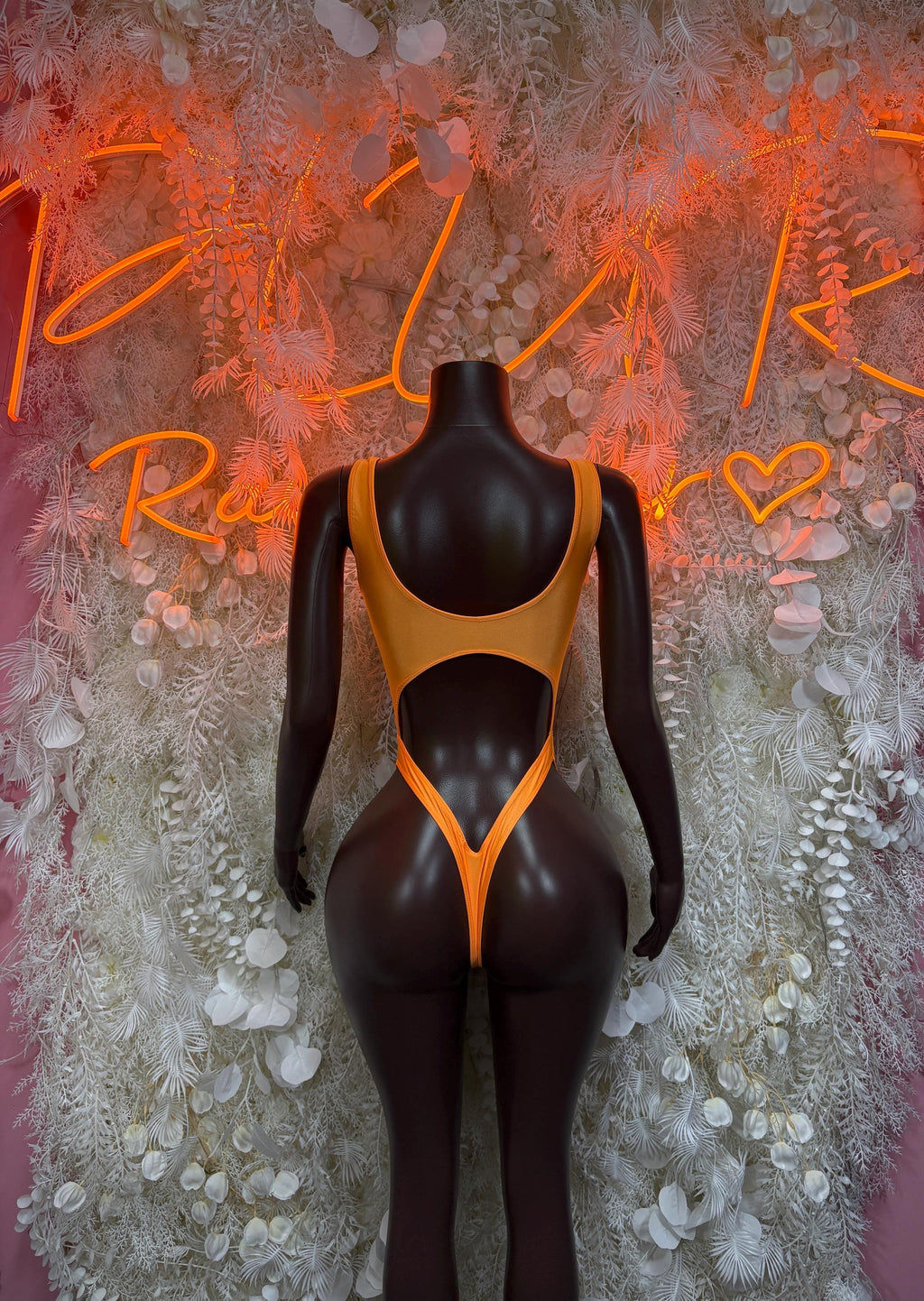 Orange V-neck cutout bodysuit with lace-up front