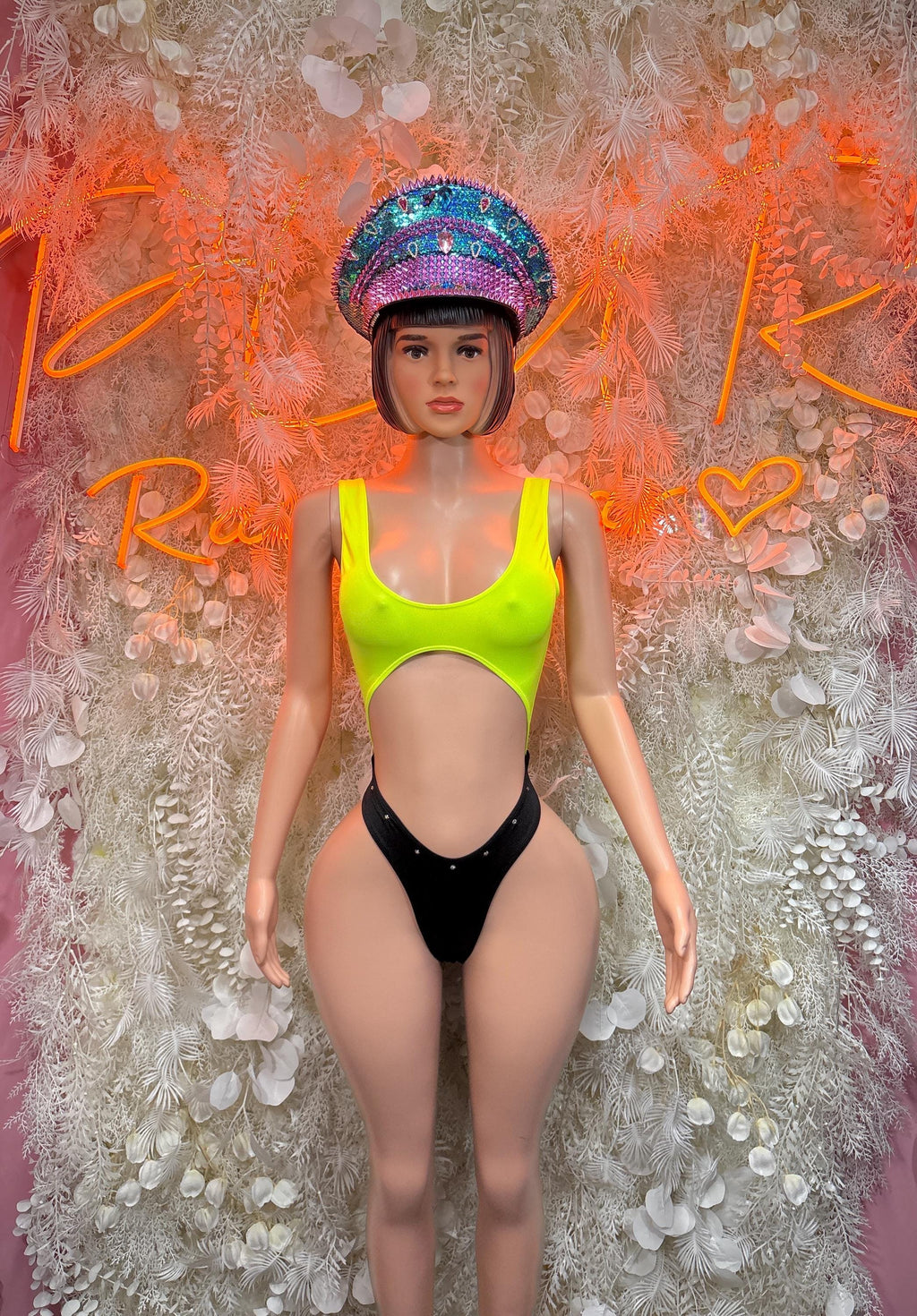Neon green one-piece festival bodysuit with black bottoms and scoop neckline