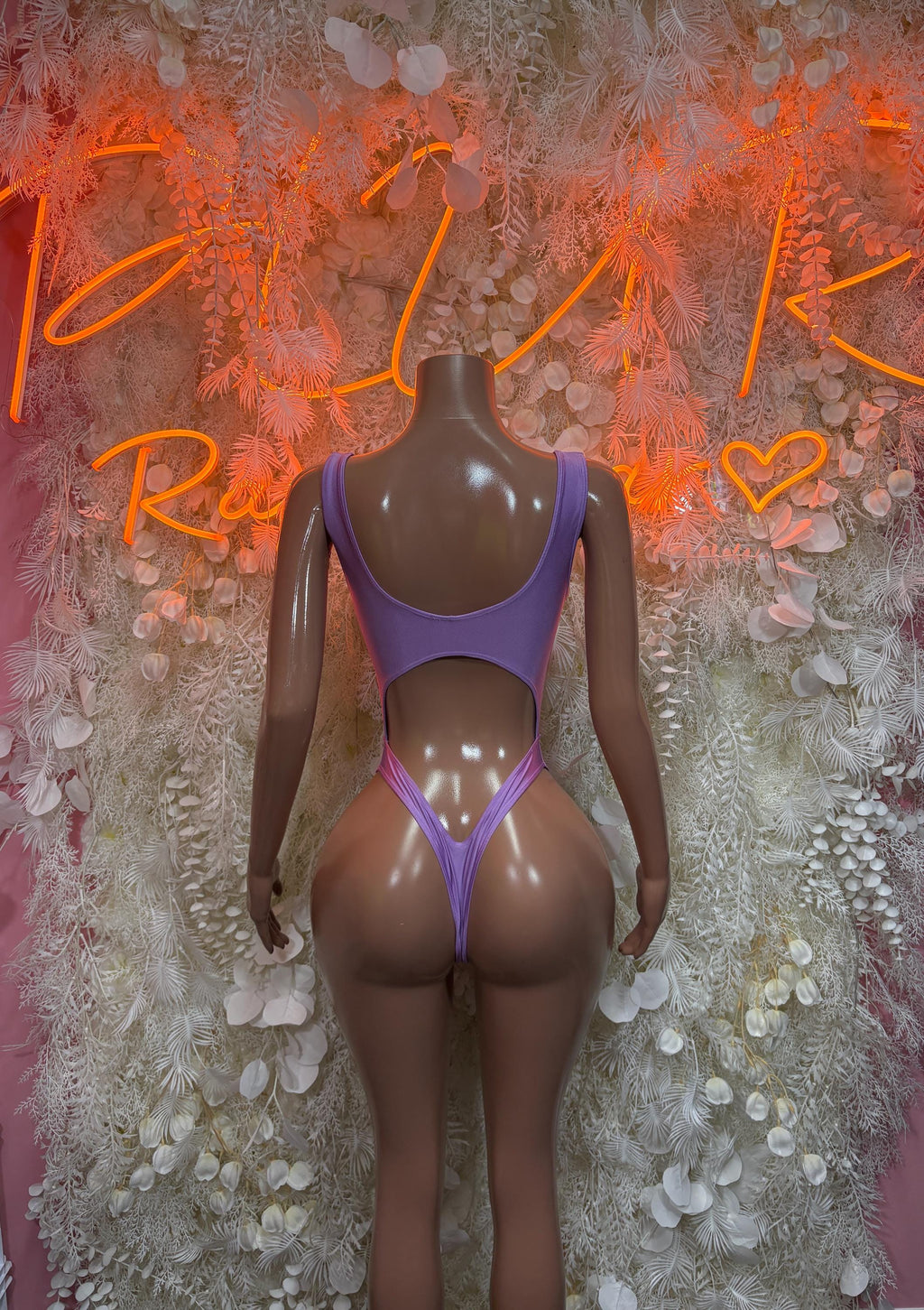Lilac one-piece bodysuit with V-front and thin shoulder straps