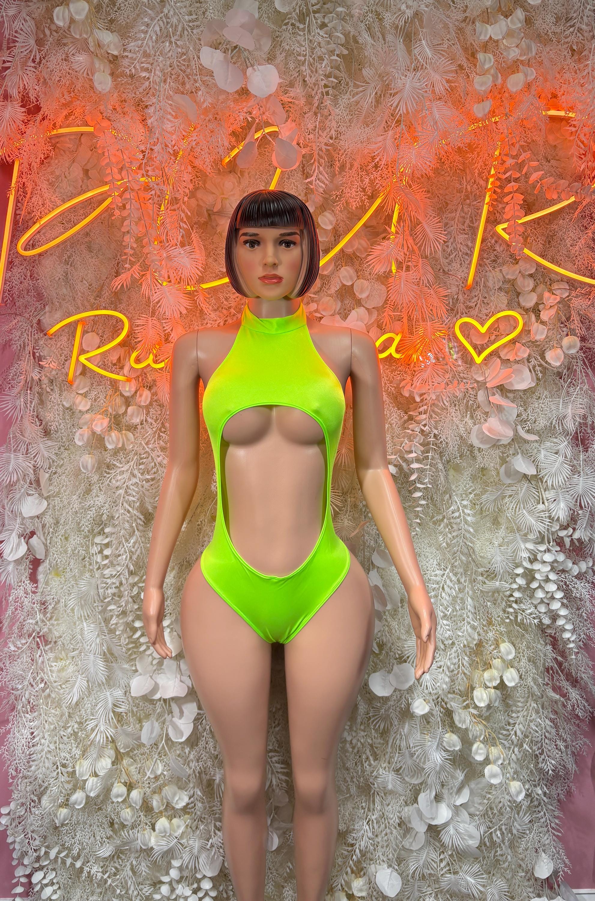 Neon green cutout one-piece swimsuit with halter neckline and high-leg cut