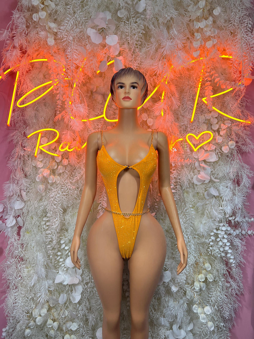One-piece orange rhinestone bodysuit with V-cut chest and narrow straps