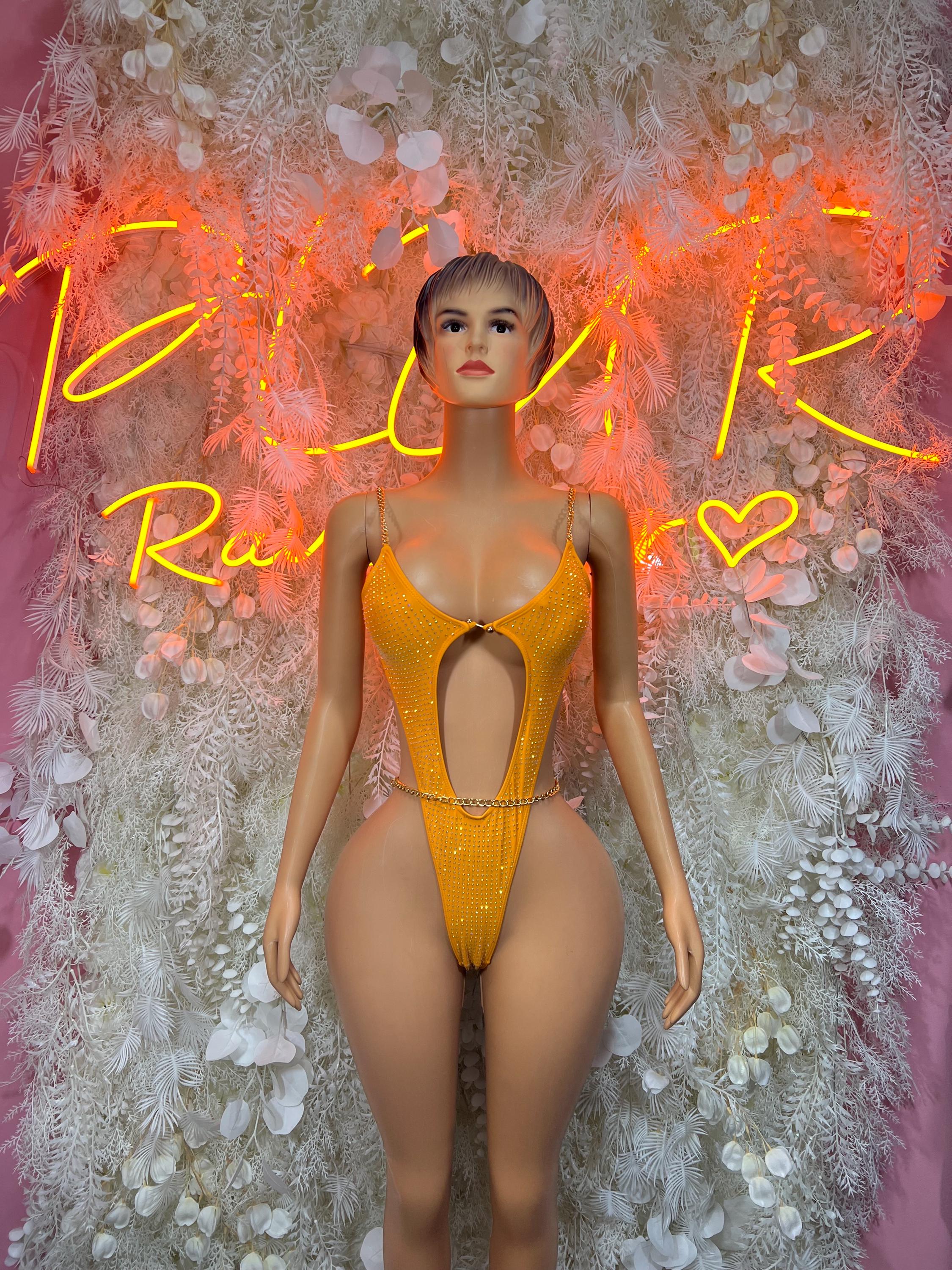 One-piece orange rhinestone bodysuit with V-cut chest and narrow straps