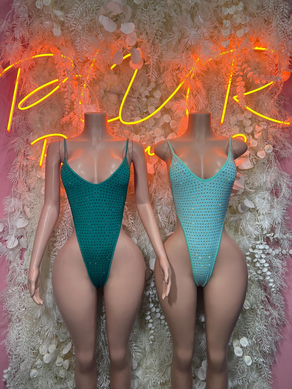 Teal rhinestone one-piece bodysuit, two front views, scoop neckline and high cut