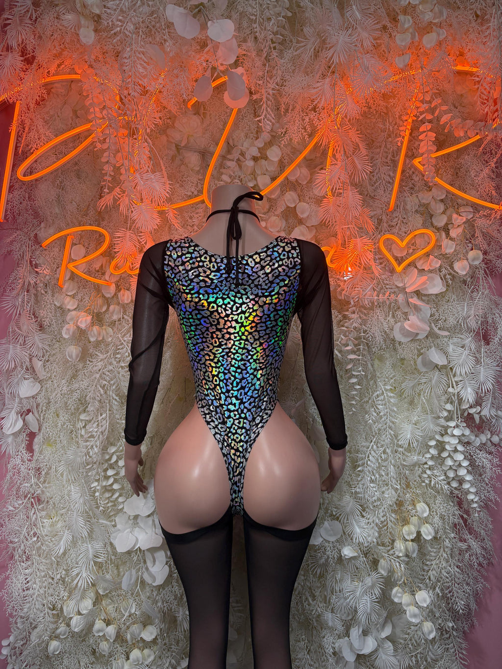 Black one-piece bodysuit with metallic cheetah print and sheer mesh back straps