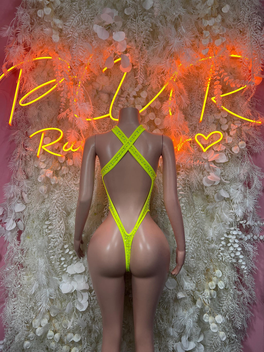 Neon green mesh one-piece bodysuit with halter straps and back cutout