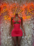 Halter mini dress with V neckline, sleeveless bodycon silhouette, fitted coral-pink