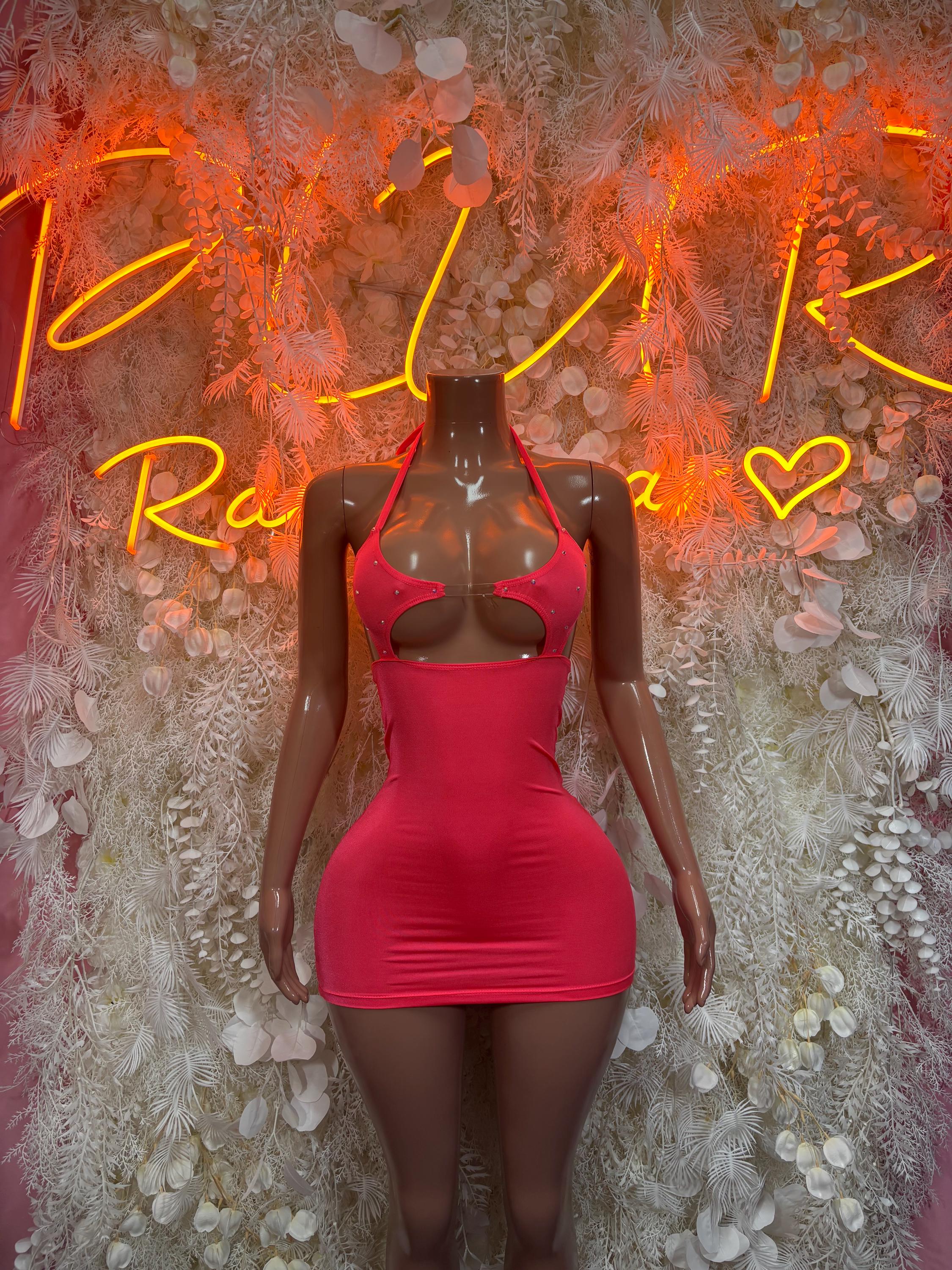Halter mini dress with V neckline, sleeveless bodycon silhouette, fitted coral-pink