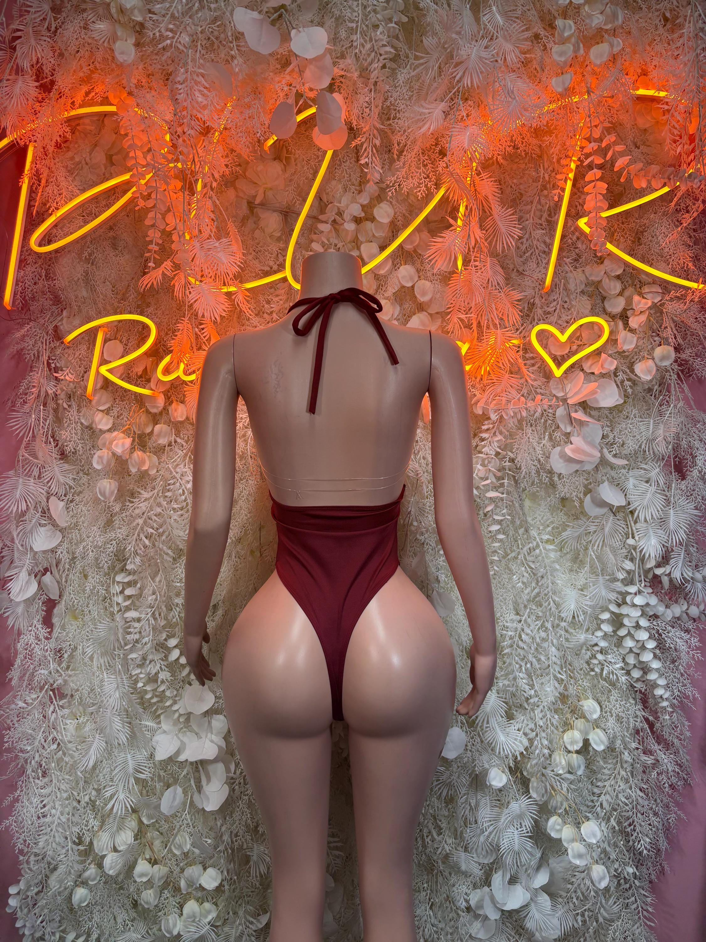 Burgundy backless sleeveless bodysuit with knotted neck tie and high-cut leg