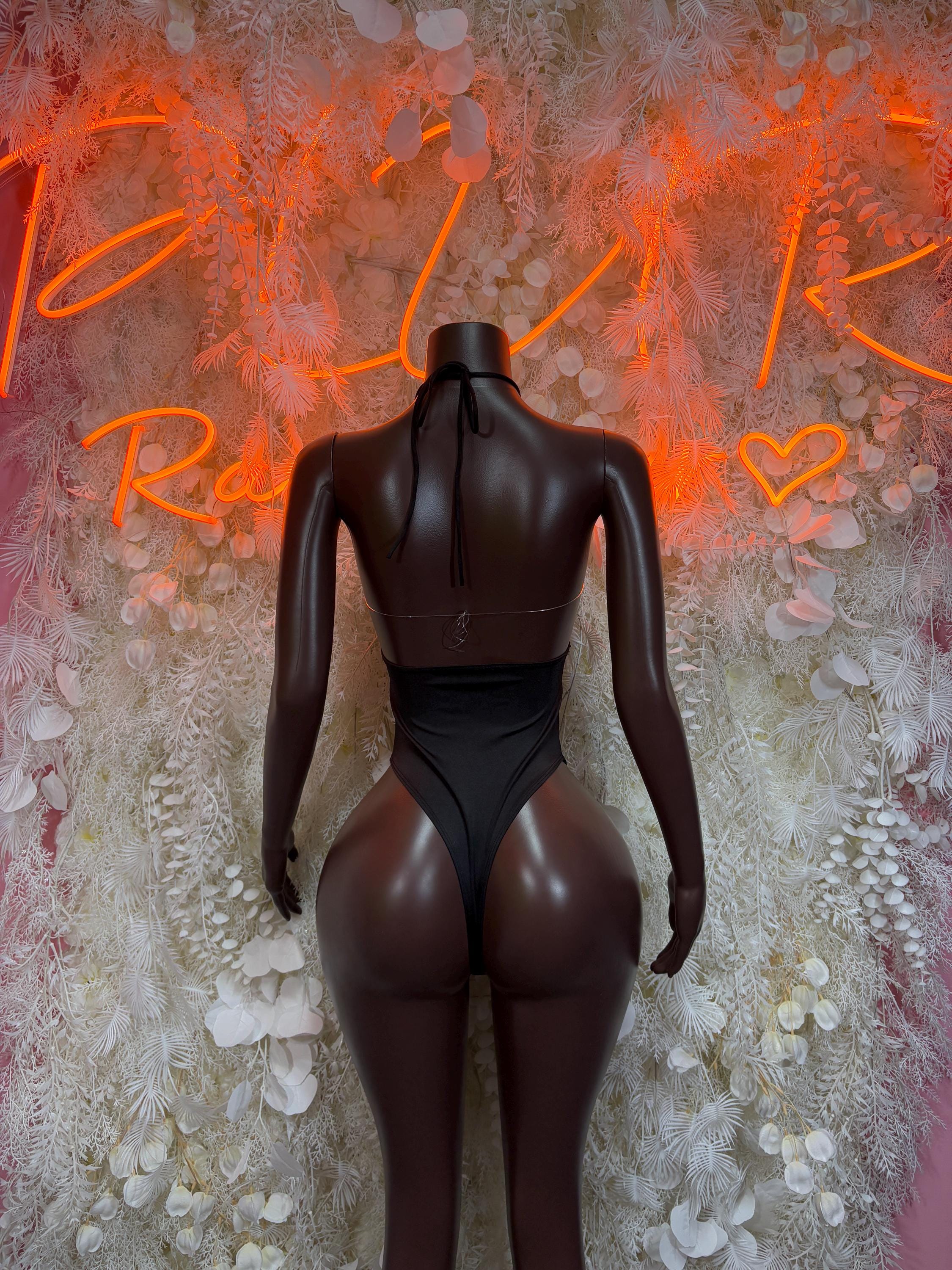 Black open-back bodysuit with back cutout and high neck