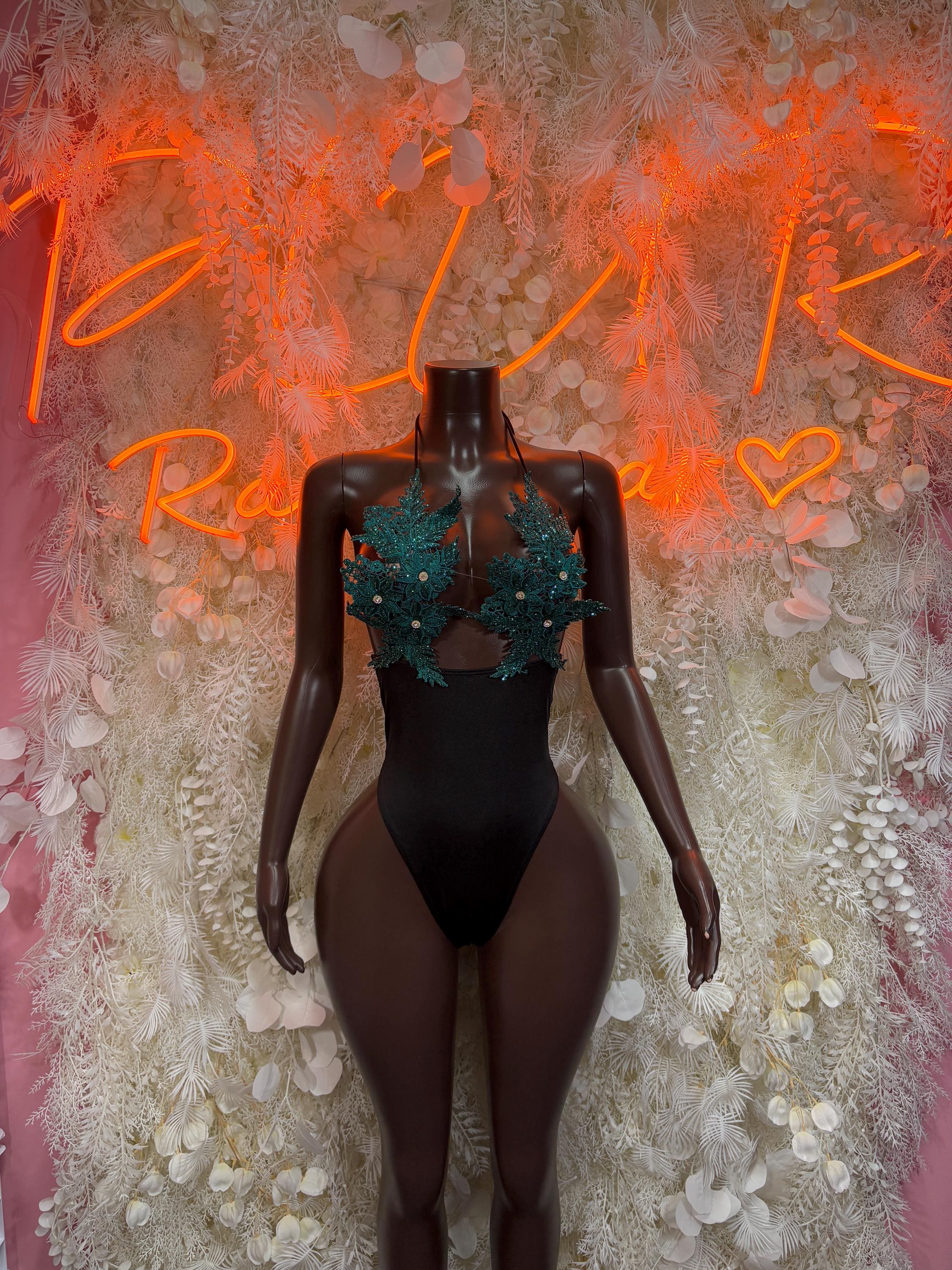 Black feather-and-lace rave bodysuit with green embellished mesh bra cups