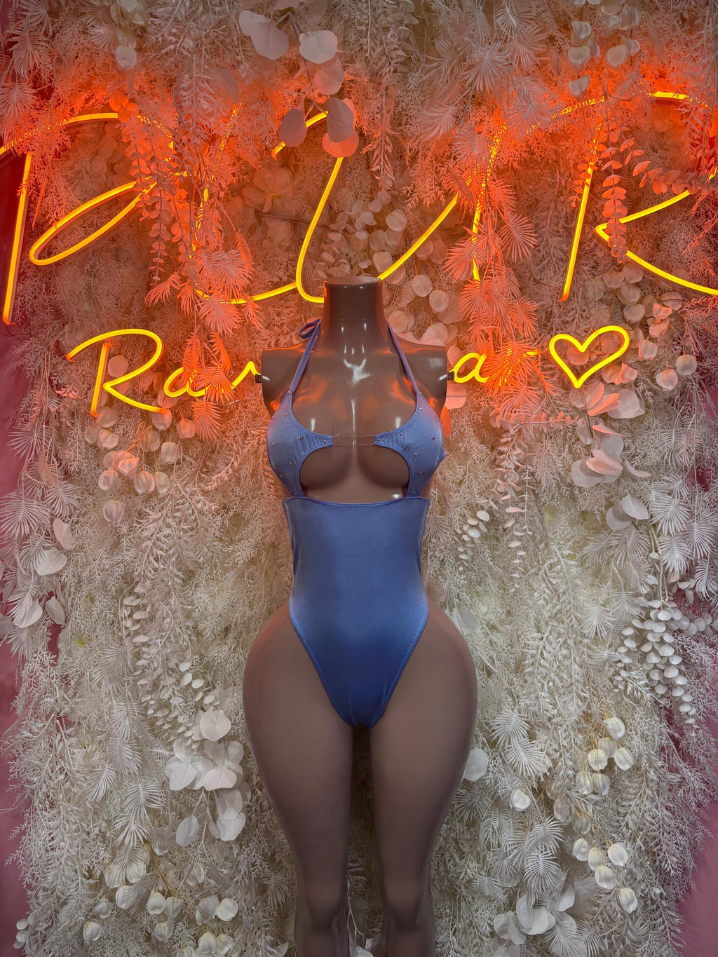 Blue one-piece bodysuit with scoop front and high-cut legs