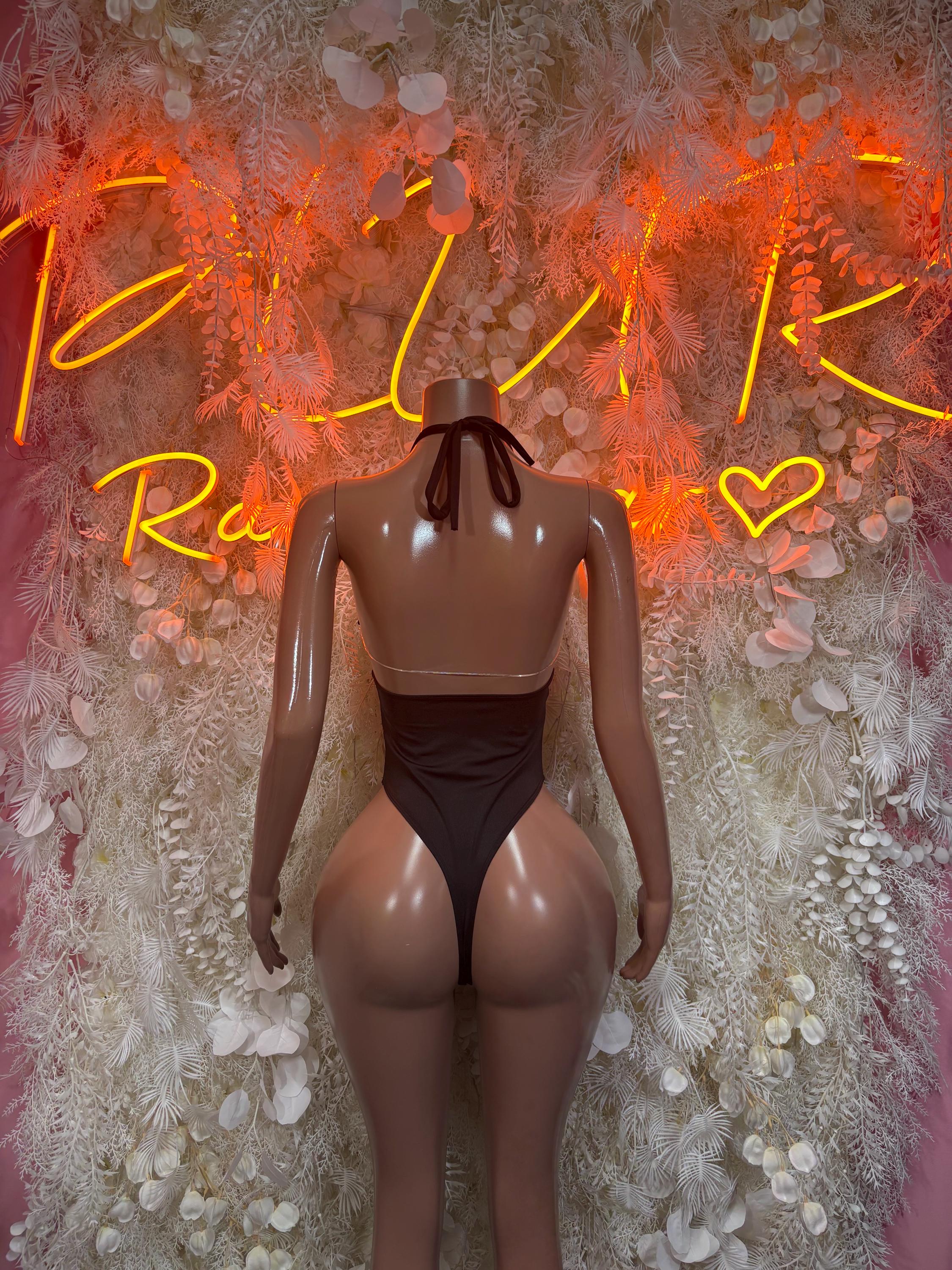 One-piece festival bodysuit, black back view with open straps and high-leg cut