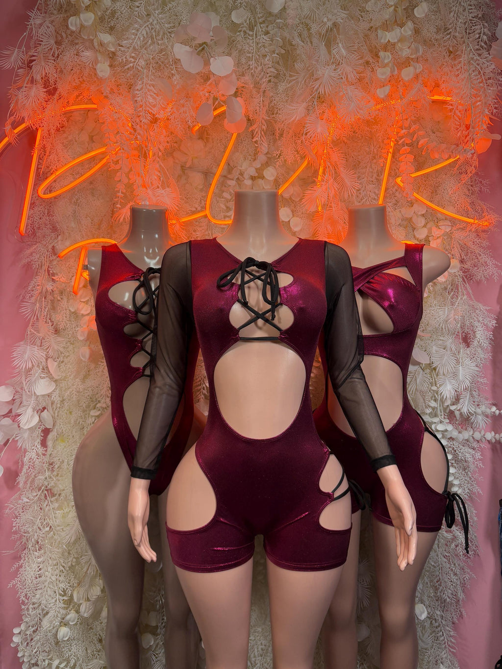 Cherry red rave bodysuit with lace-up chest, sheer mesh sleeves, and side cutouts