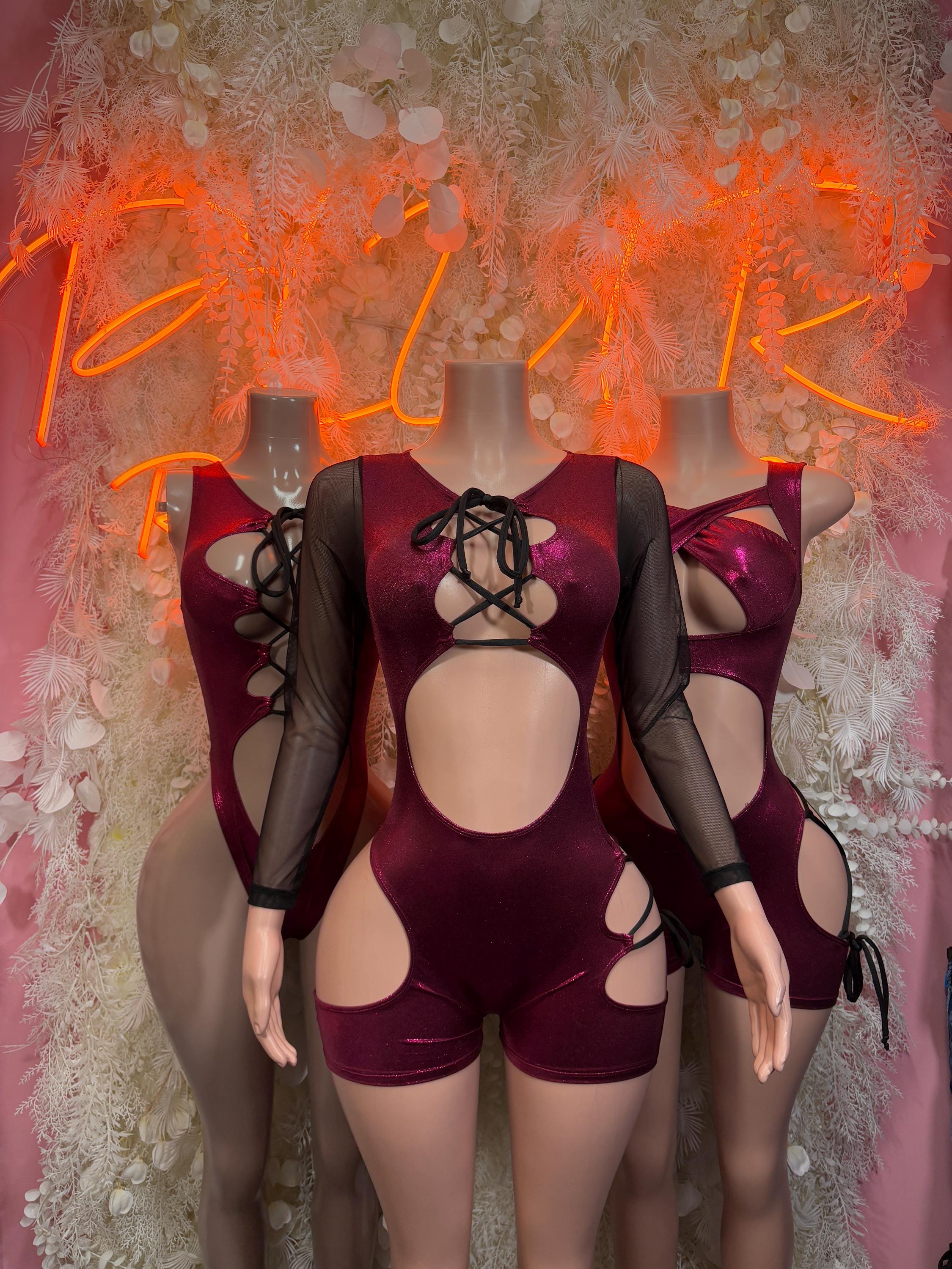 Cherry red rave bodysuit with lace-up chest, sheer mesh sleeves, and side cutouts