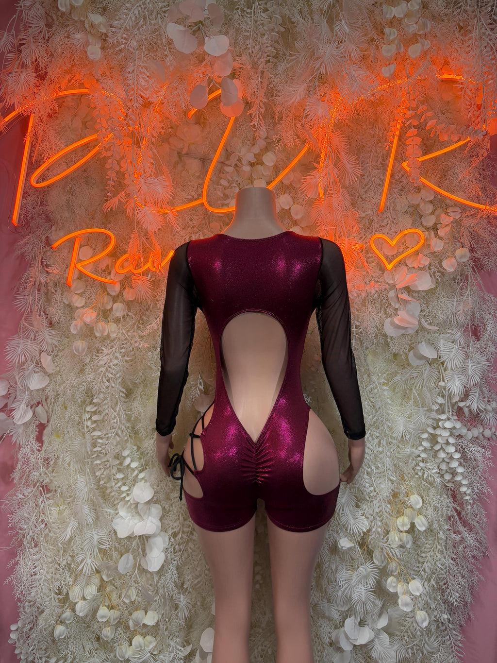 Cherry red backless lace-up rave bodysuit with sheer long sleeves and v-cut back