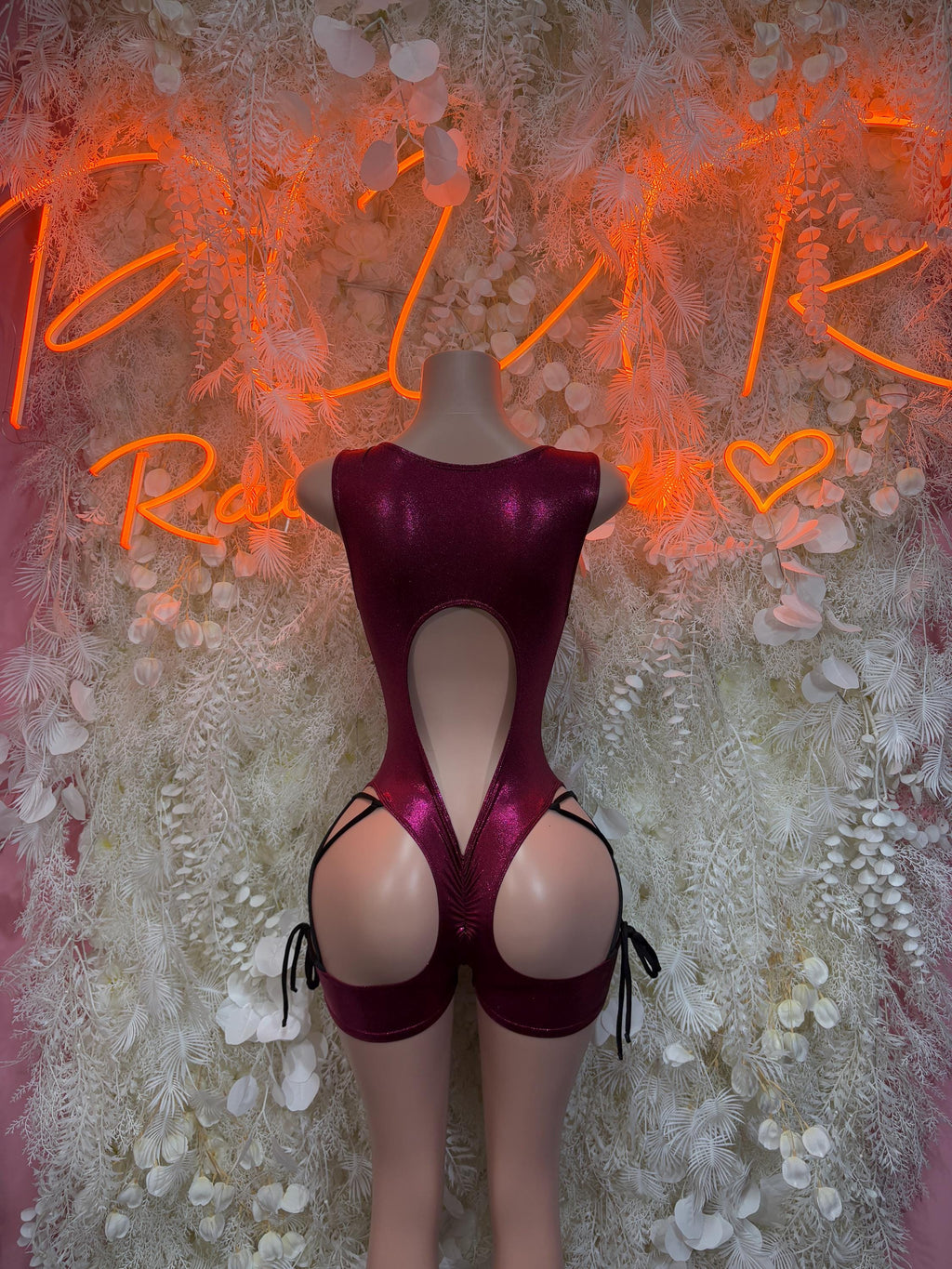 Maroon open-back rave bodysuit with halter straps and deep front cutout