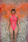 Coral ribbed halter bodysuit with cutout stripes and high-leg fit