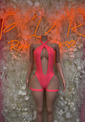 Coral one-piece halter bodysuit with oval cutout and high-leg bottom