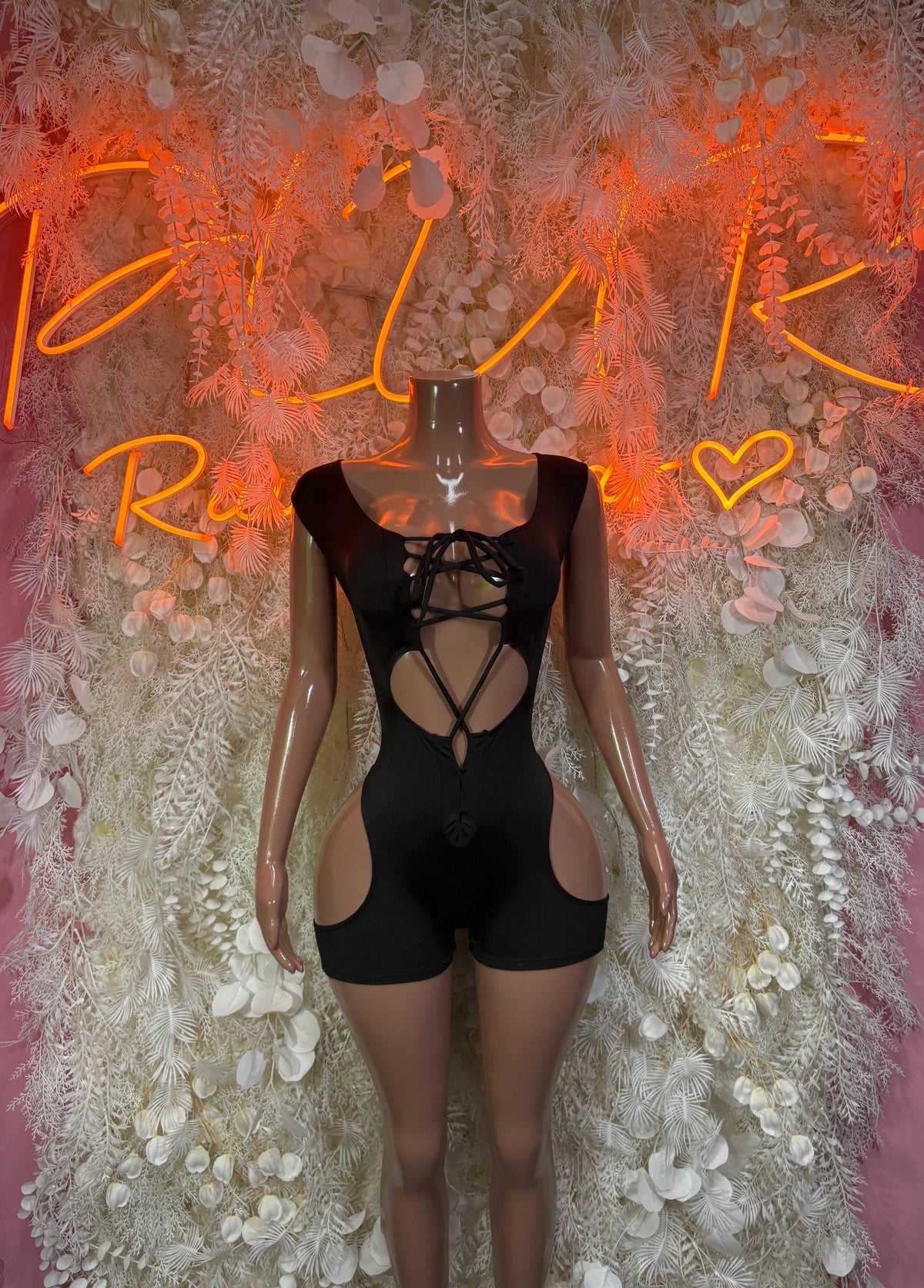 Black rave bodysuit with lace-up front, crisscross straps, sheer cutout panels