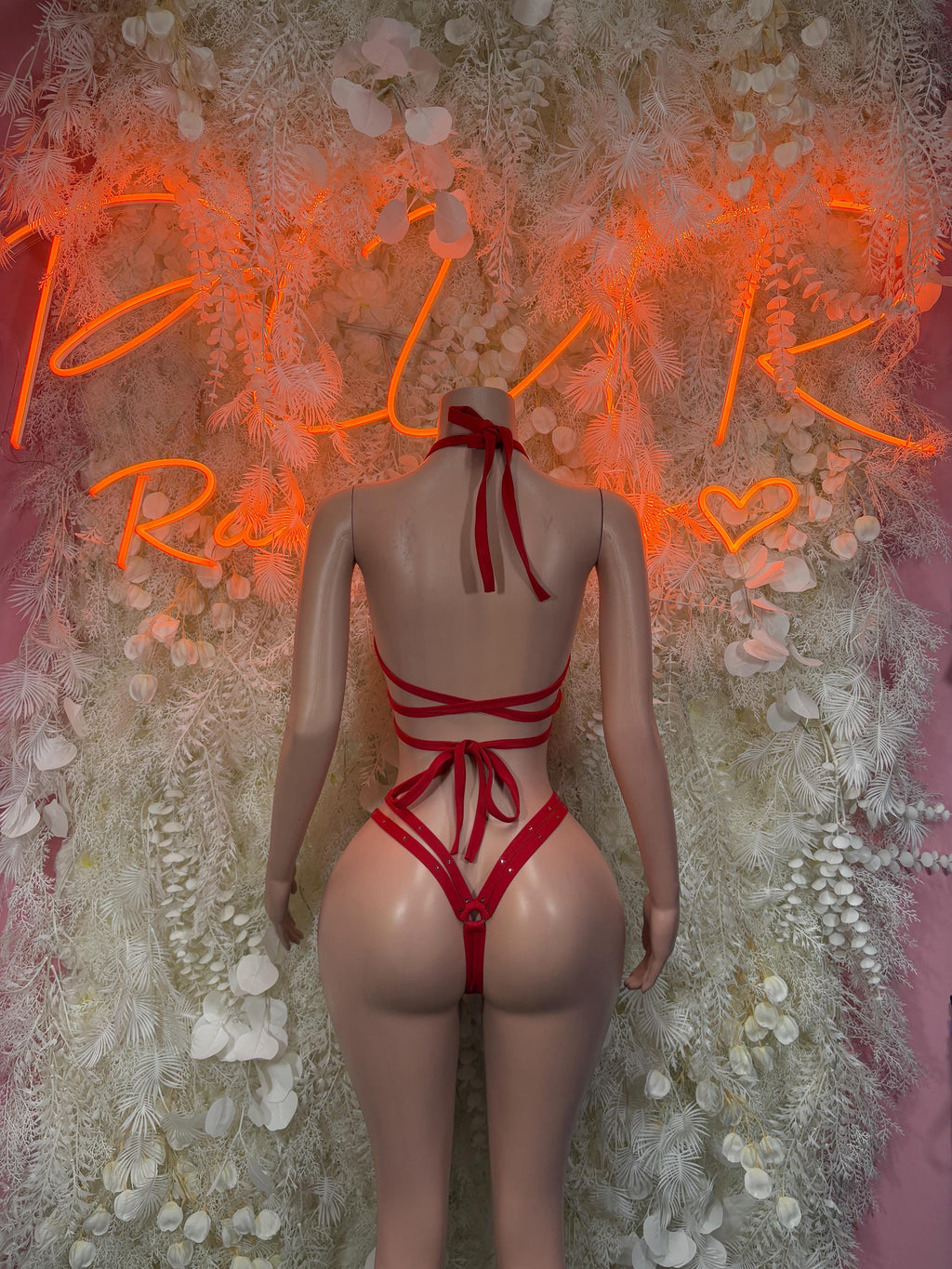 Ravewear red one-piece bikini with crisscross back straps and tie at upper back