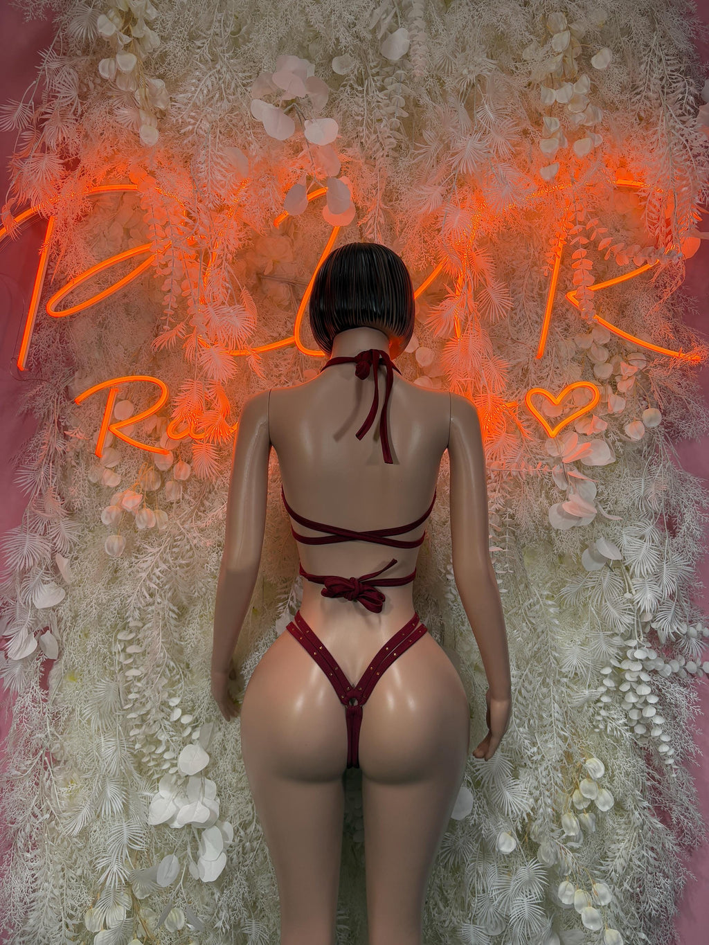 Red strappy backless one-piece rave bodysuit with crisscross straps