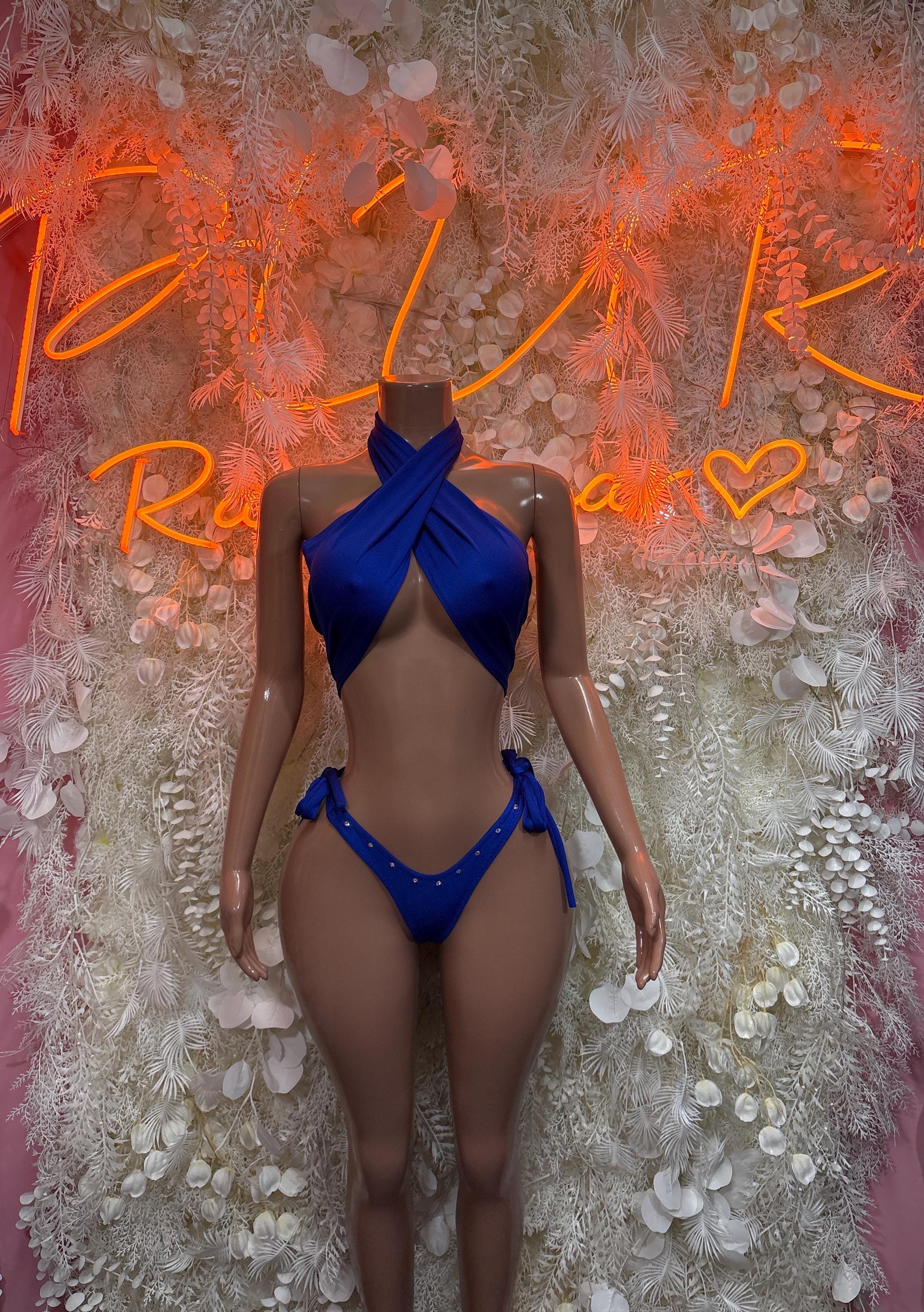 Purple halter one-piece festival outfit with cross front ties and open back