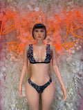 Two-piece bikini outfit in metallic dark fabric, V-neck top and matching bottoms