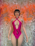 Pink halter one-piece swimsuit with deep V front and tie detail