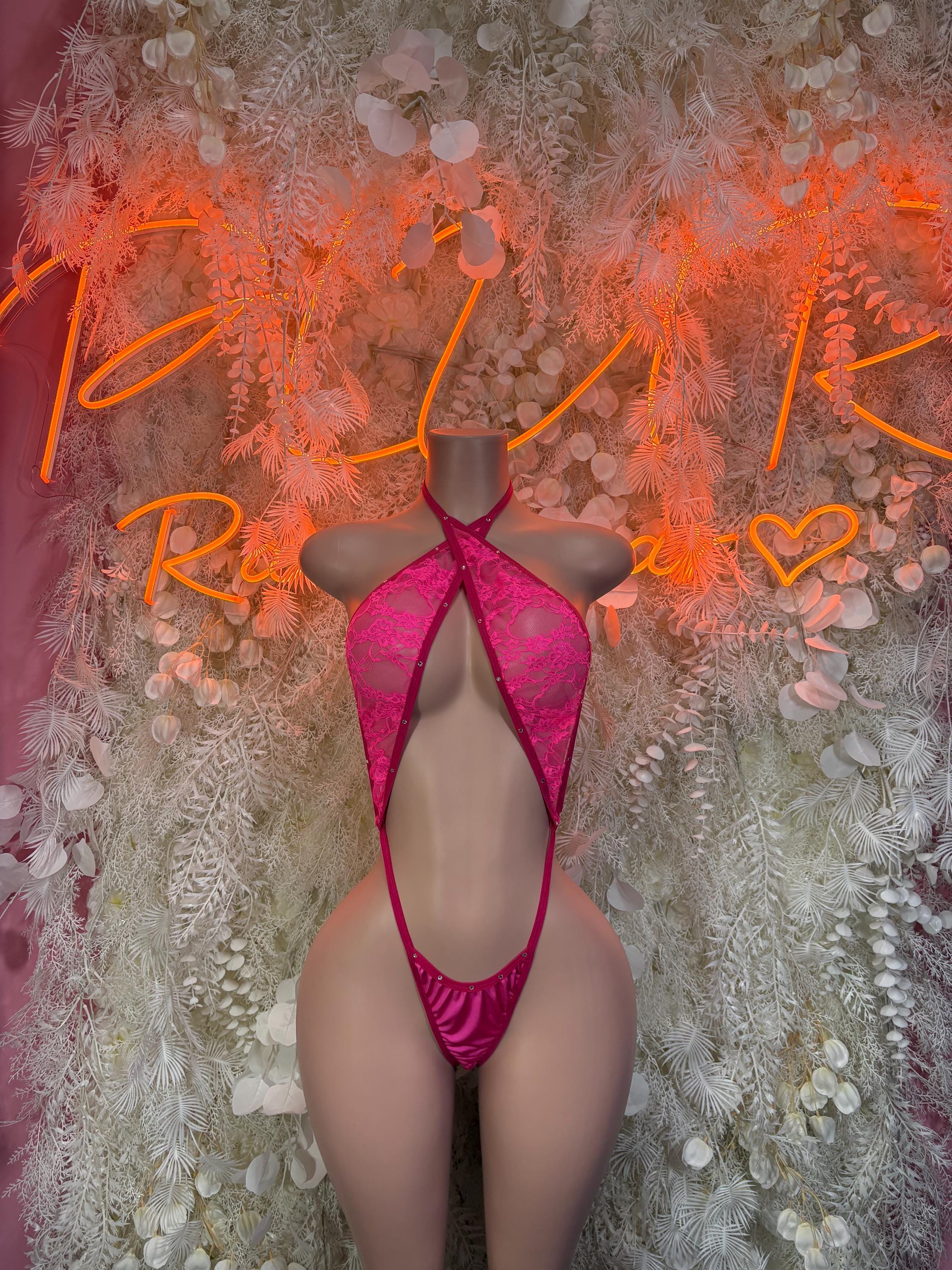 Pink lace slingshot bodysuit with V-front cutout and adjustable shoulder straps