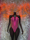 Pink fishnet rave bodysuit with V-neck and thong front