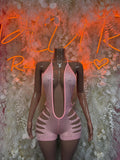 Pink rhinestone cutout bodysuit with halter neckline and open sides, short shorts