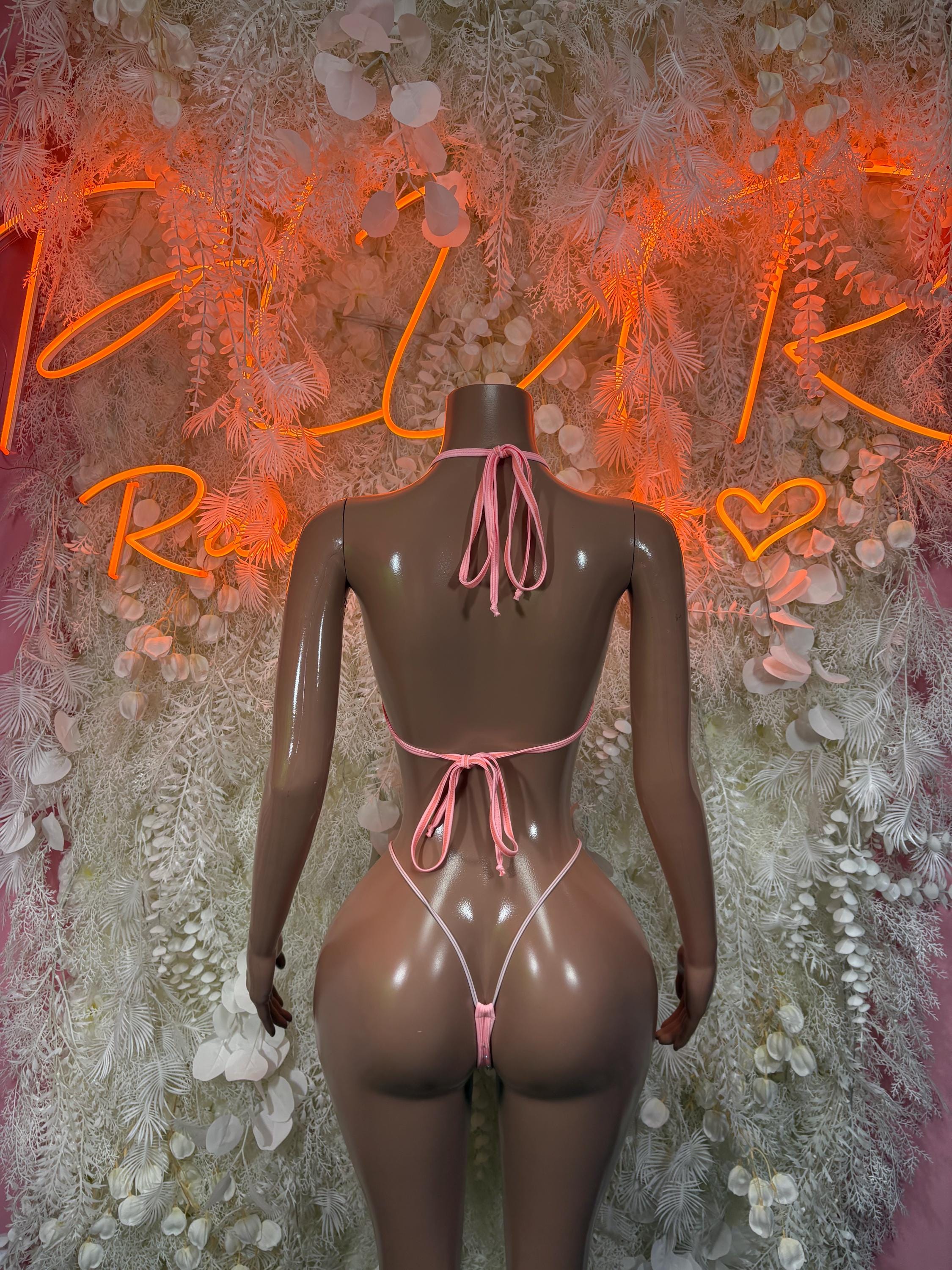 Pink rhinestone one-piece bodysuit with open back and long tie strings