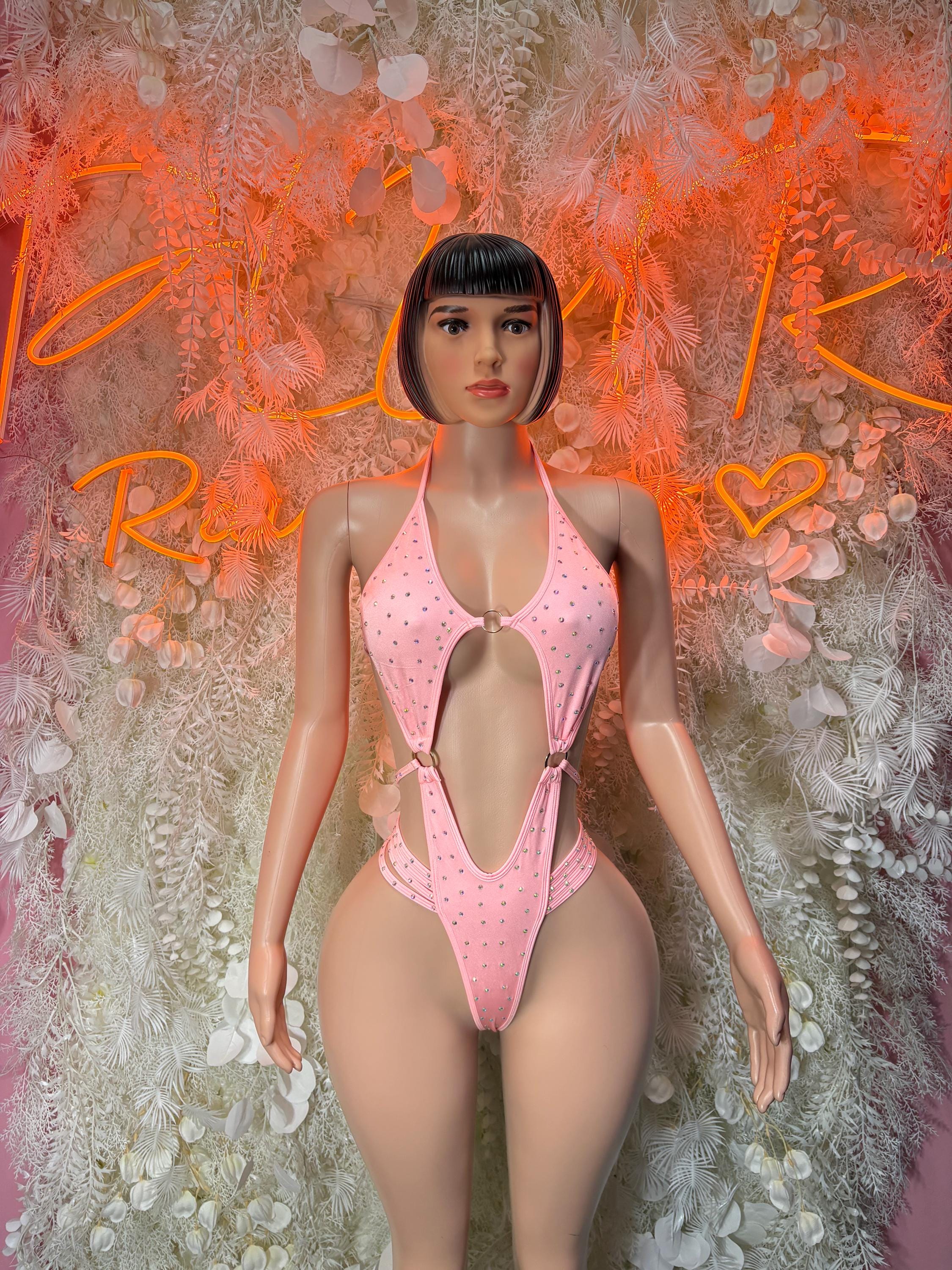 Pink rhinestone one-piece bodysuit with deep V neckline and open back straps