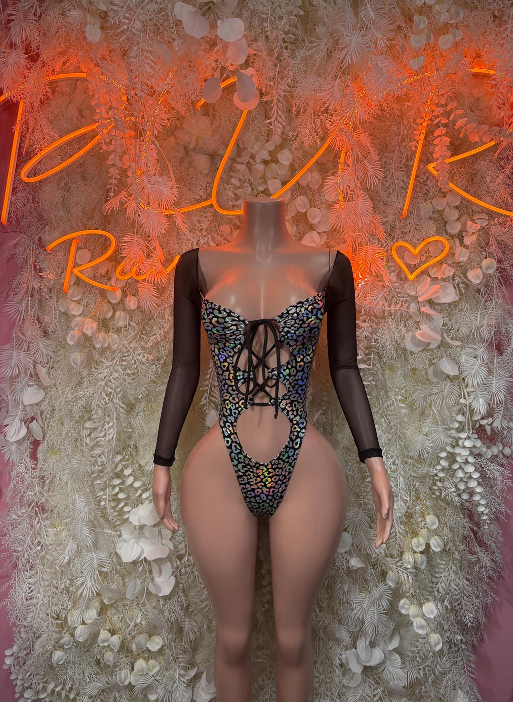 Black long-sleeve cheetah-print bodysuit with lace-up back and cutout front