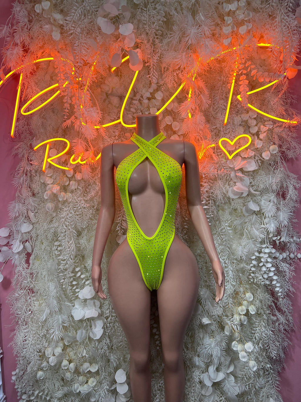 Neon green mesh one-piece bodysuit with crisscross back cutout