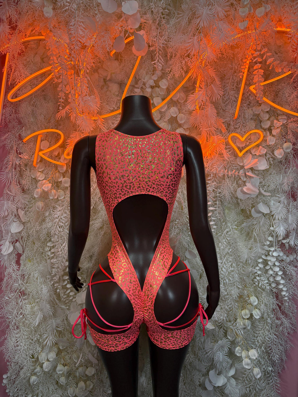 Coral cheetah-print backless bodysuit with lace-up straps and cutout back