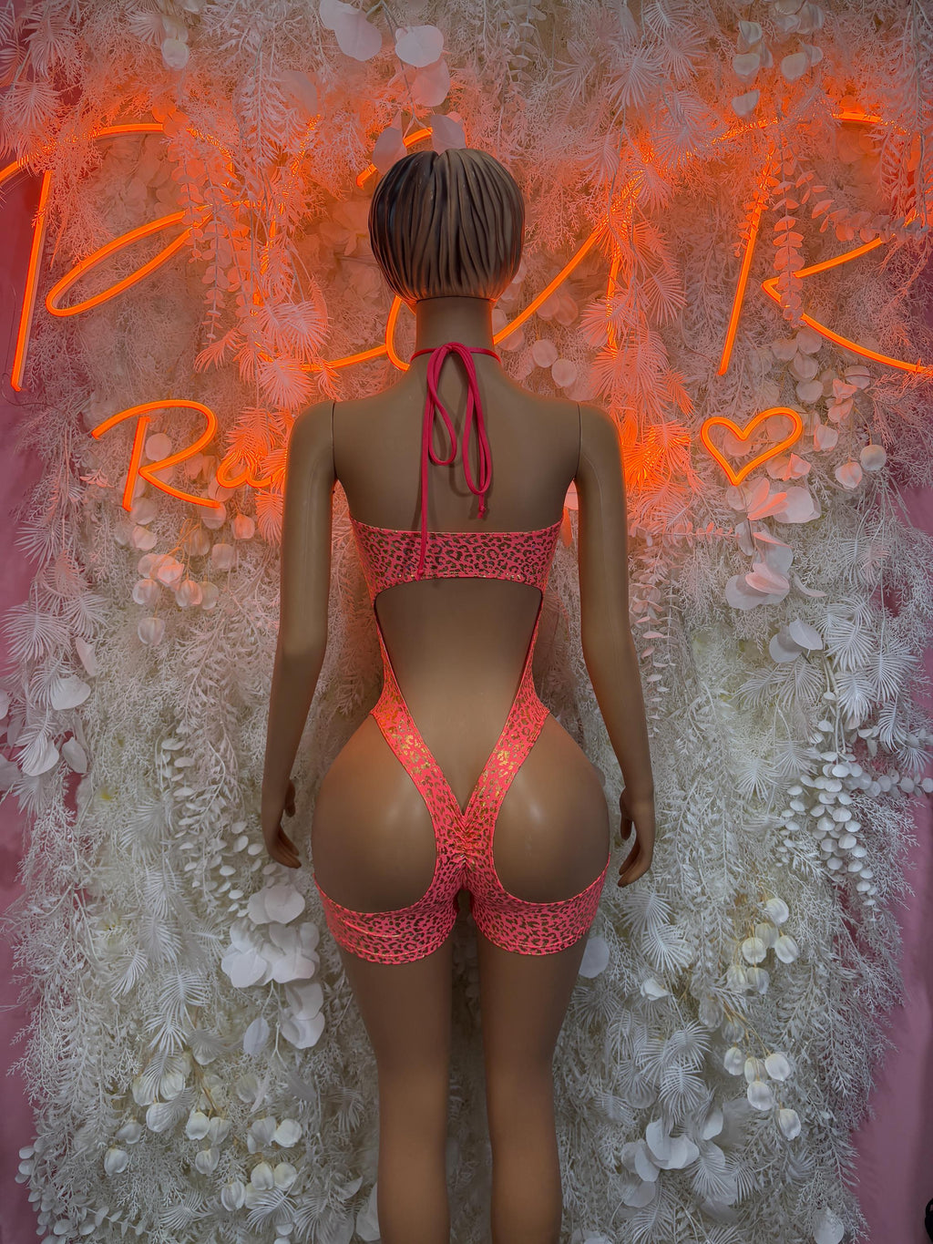 Coral cheetah-print backless bodysuit with crisscross tie straps and high-cut legs